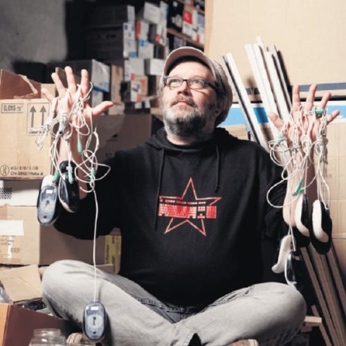 Man Black Sweater Holding Cords